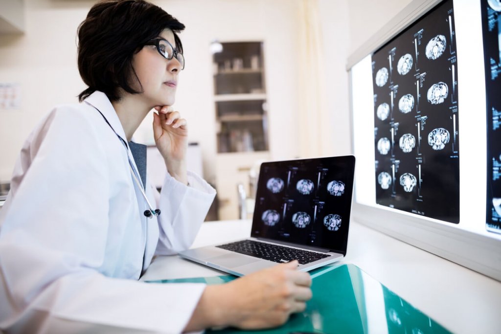 Doctor examining radiology scans