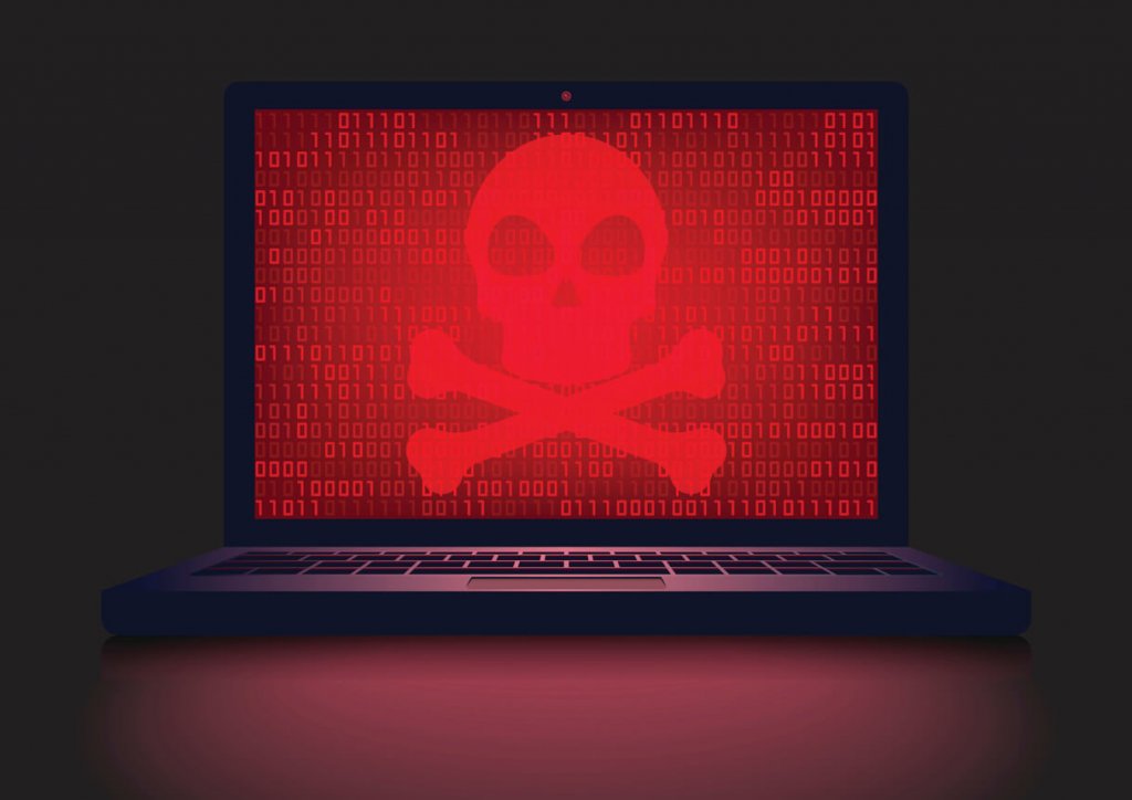 Laptop with a red, glowing crossbones on it. Ransomware.