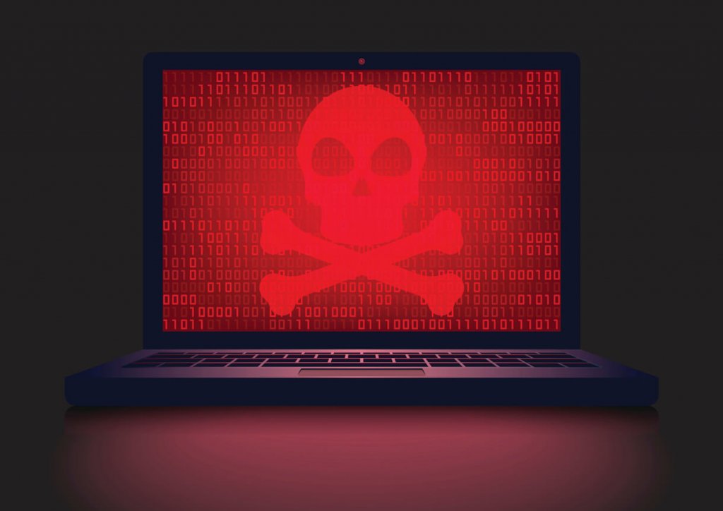 Laptop with a red, glowing crossbones on it. Ransomware.