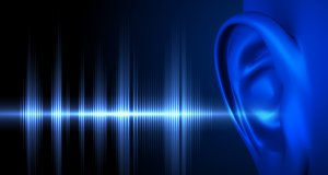 Digital blue soundwave entering a digitized, blue. human's ear