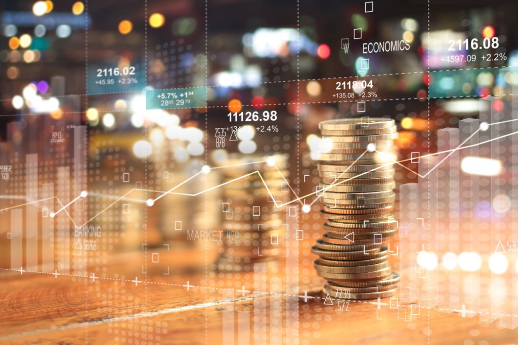 Double exposure with businesss charts of graph and rows of coins for finance at night city background.