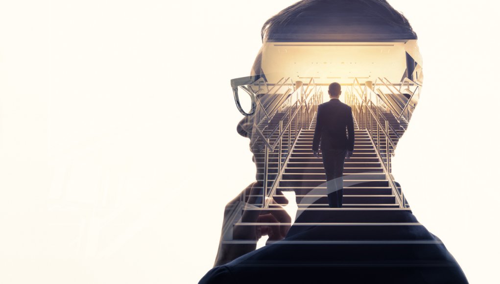 Double exposure of a businessman and stairs. Success of business concept.