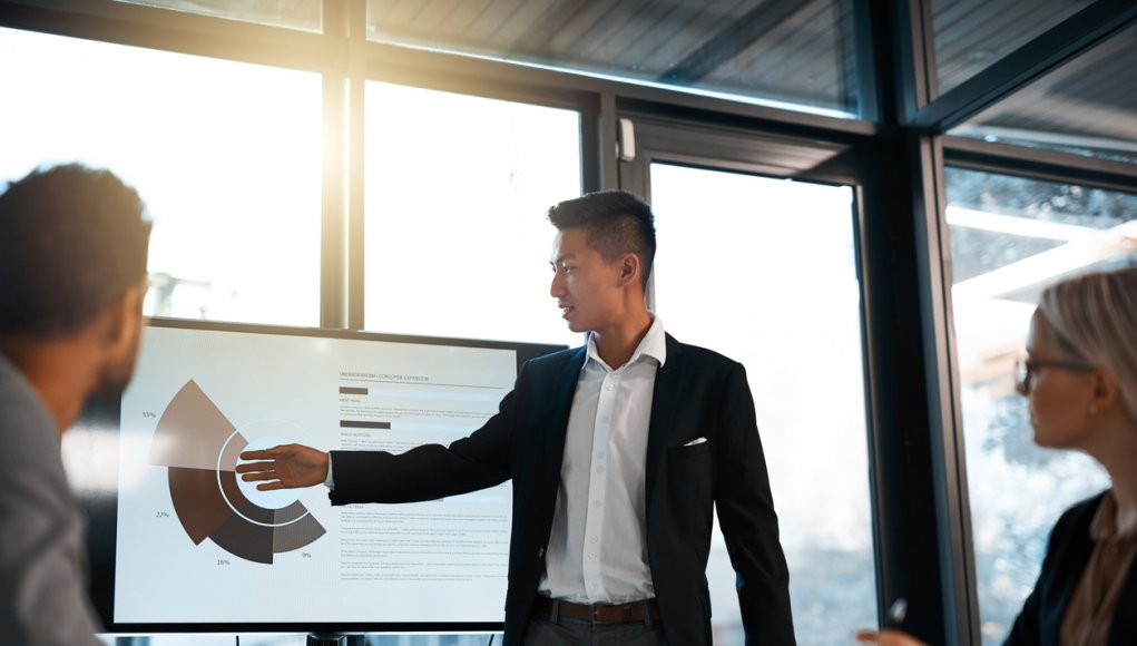 Shot of a young businessman giving a presentation to his colleagues in an office