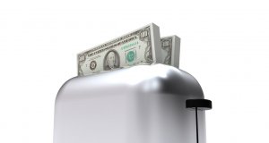 A toaster machine (for bread) with money emerging from it