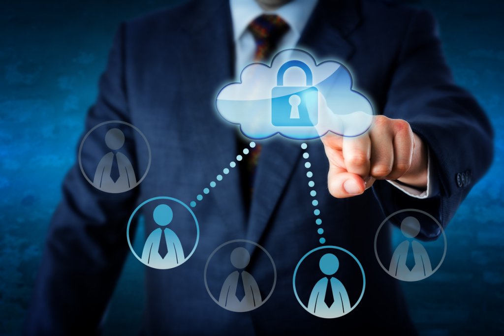 Cloud security intelligence related image. Executive is touching a cloud.