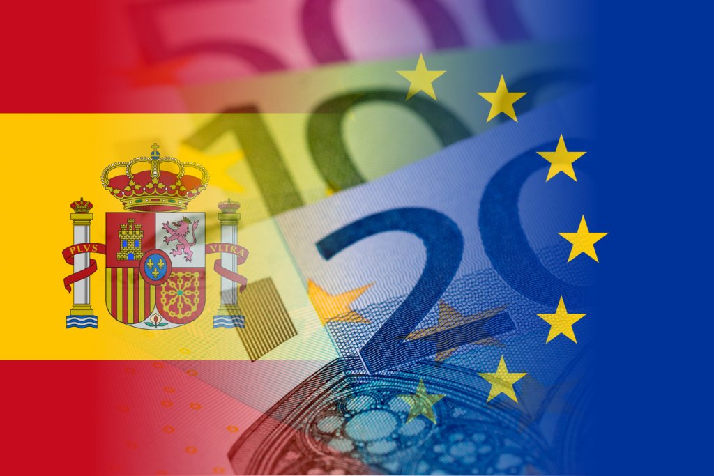 spain and eu flags with euro banknotes