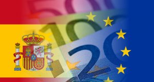 spain and eu flags with euro banknotes