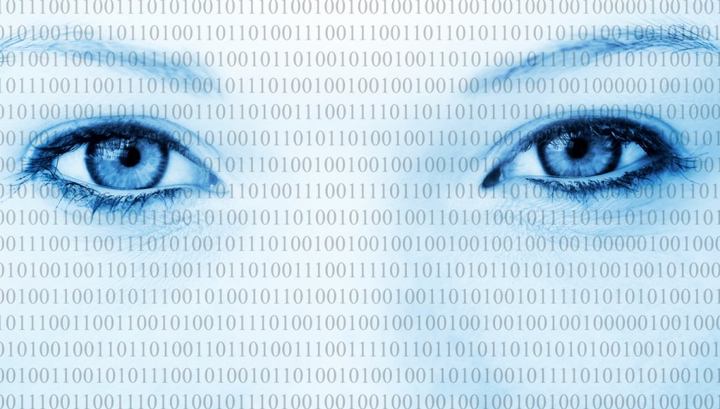 Eyes of a woman with binary code running across her face