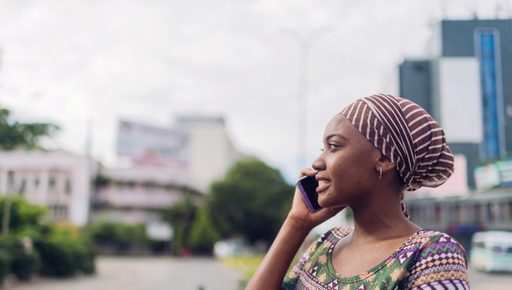 African business woman speaks on the phone