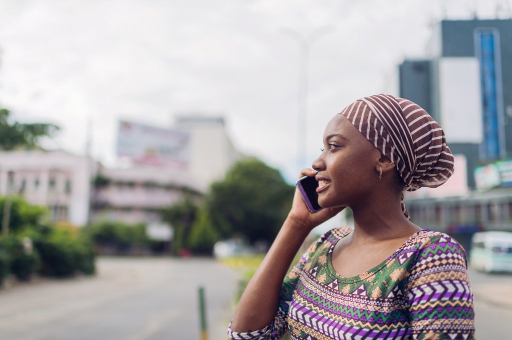 African business woman speaks on the phone