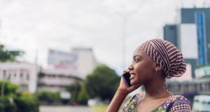 African business woman speaks on the phone