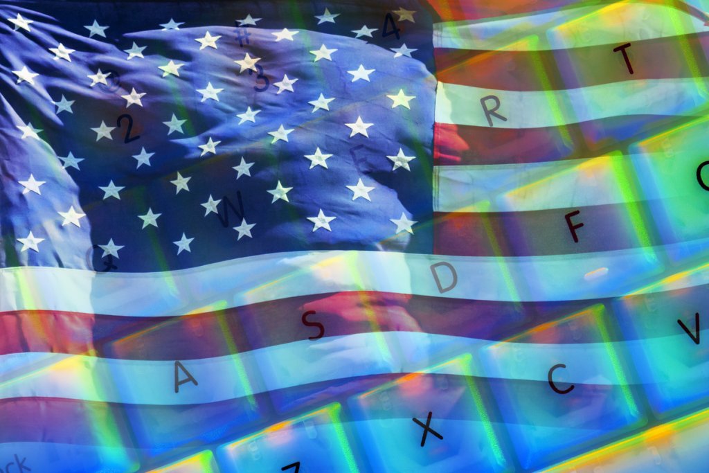 American Flag Overlaid on Colorful Computer Keyboard.