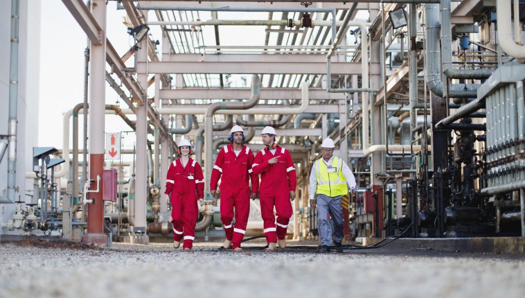 Workers walking at gas plant