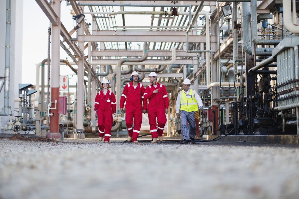 Workers walking at gas plant