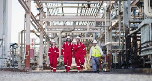 Workers walking at gas plant