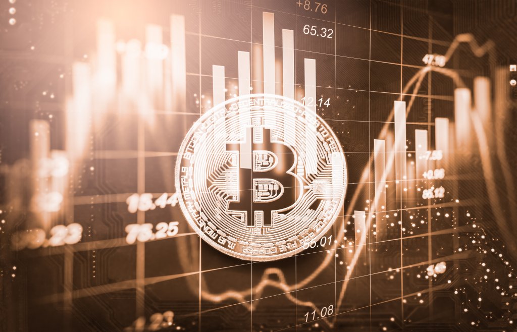 Abstract graphs and charts behind a Bitcoin symbol