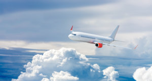 Airplane flying above clouds