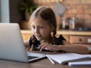 Girl learning on laptop