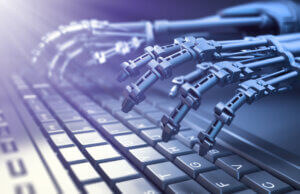 Robot typing on a computer
