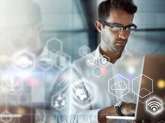 Global CISO looking at laptop and determining how to limit operational costs
