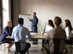 5 ways to effectively communicate cyber security value to the board CISO giving presentation to Board; concept art